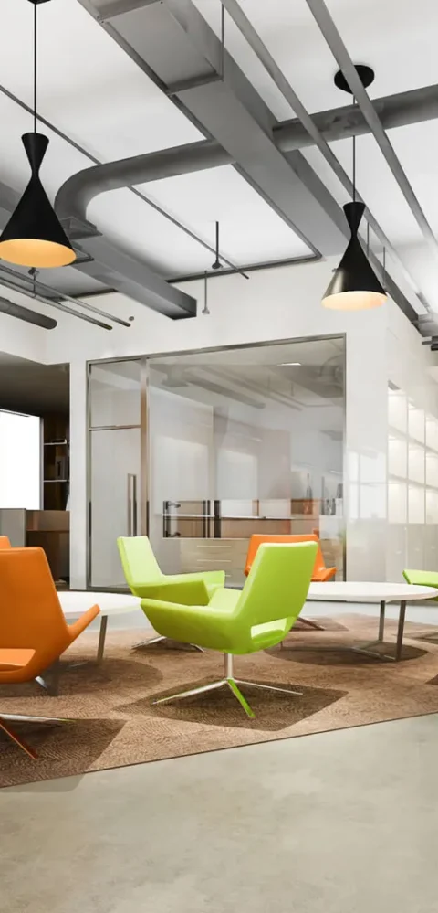 Modern office waiting area with colorful chairs and pendant lights.