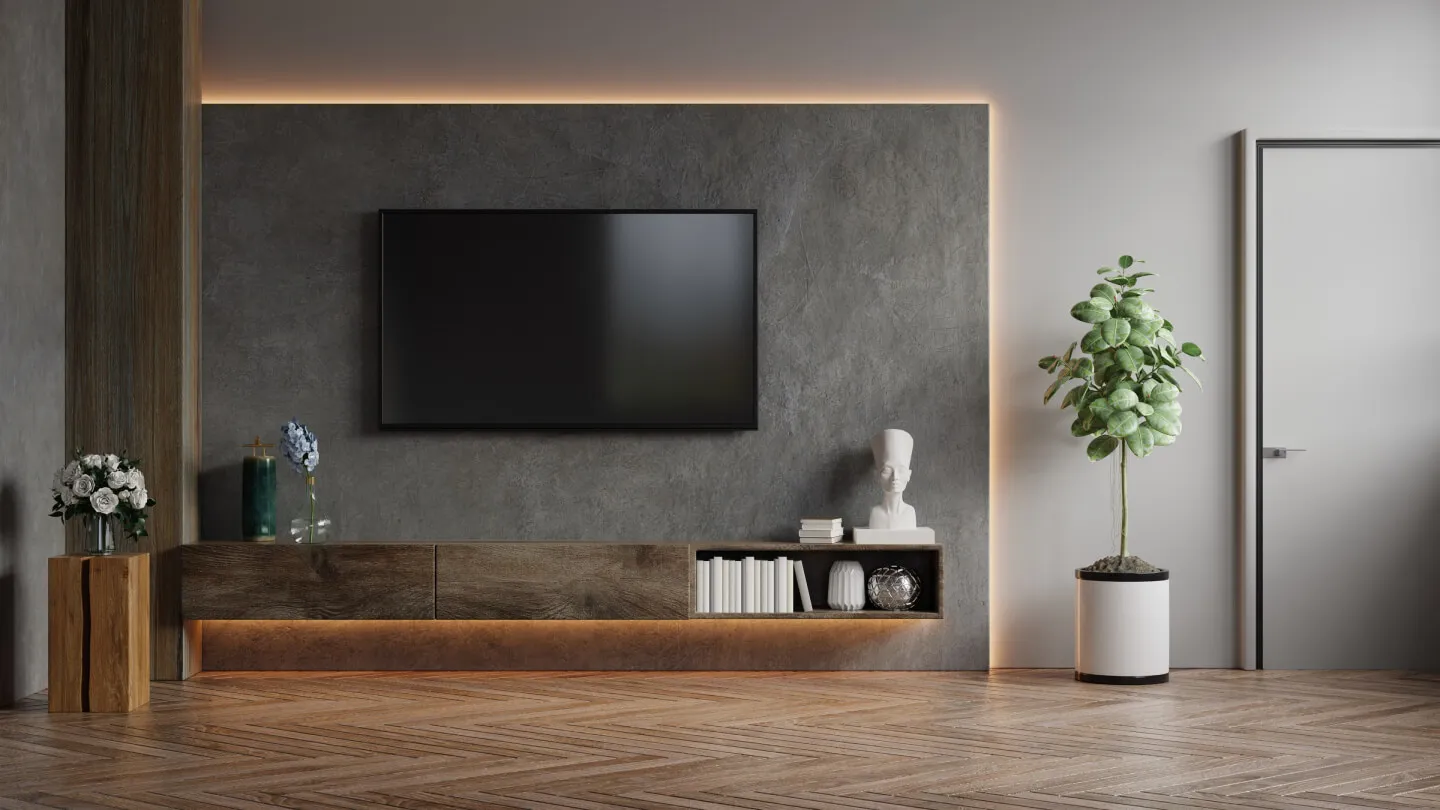 Modern living room with TV, plants, and wooden decor.